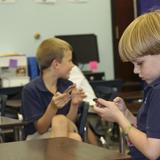 Christ Covenant School Photo - Lower School students use iPod Touches to play interactive learning games in specific subjects.