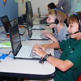 Jewish Community Day School Photo - Third, Fourth, and Fifth Grade Students work with laptops throughout the day and communicate with students from Israel during their Hebrew Language class.