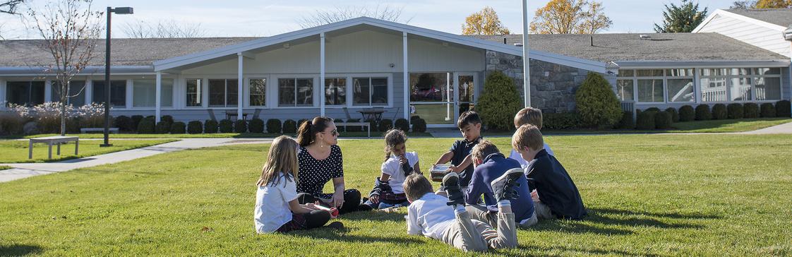 King School Photo - Grade 4 students discussing the world around them in science class.