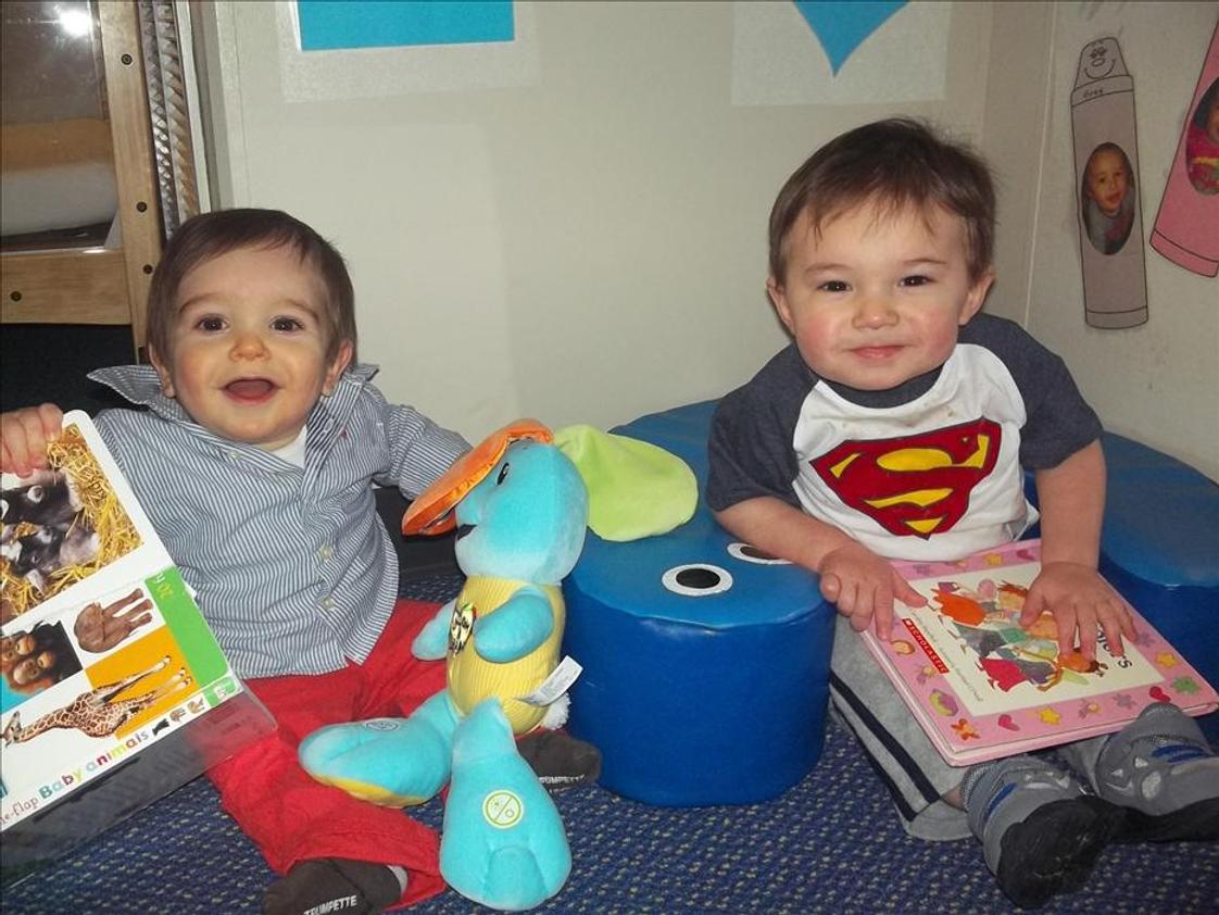 Naperville KinderCare Photo - Story time is one of the many language building activites in the infant classroom.