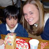 Sacred Heart School Photo - Bishop Heelan High School students work with the kindergarten students on building gingerbread houses