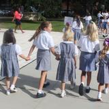 St. Mary Catholic School Photo - St. Mary Fifth Grade Buddies walk their Little Kindergarten Buddies back to class after the Friday Student Mass