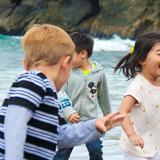 Terra Schools Photo - Children playing on the beach during earth education.