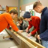 The New School Photo - TNS offers ample opportunities for hands-on learning. These math students are honing their skills with a carpentry project.