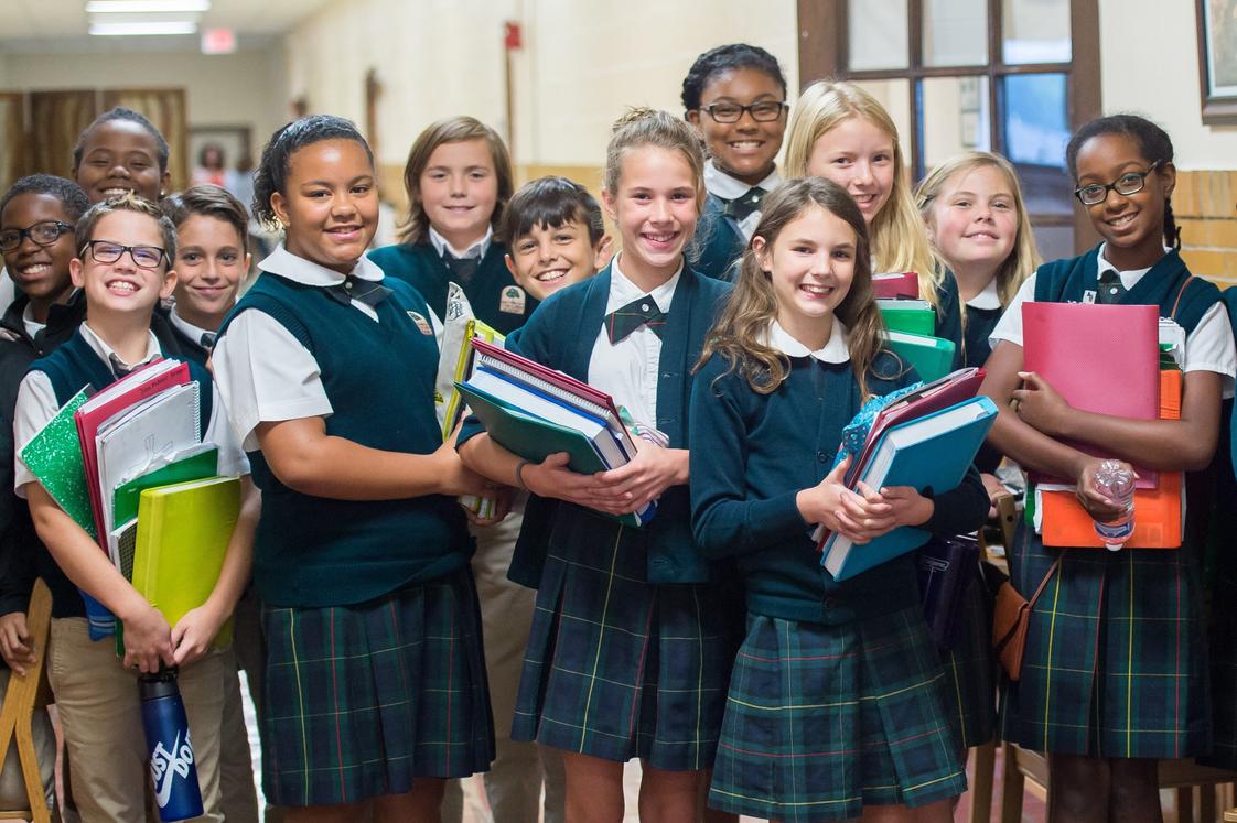 The Oaks Academy Photo - Middle School students pause for a photo in the hallway during passing period.